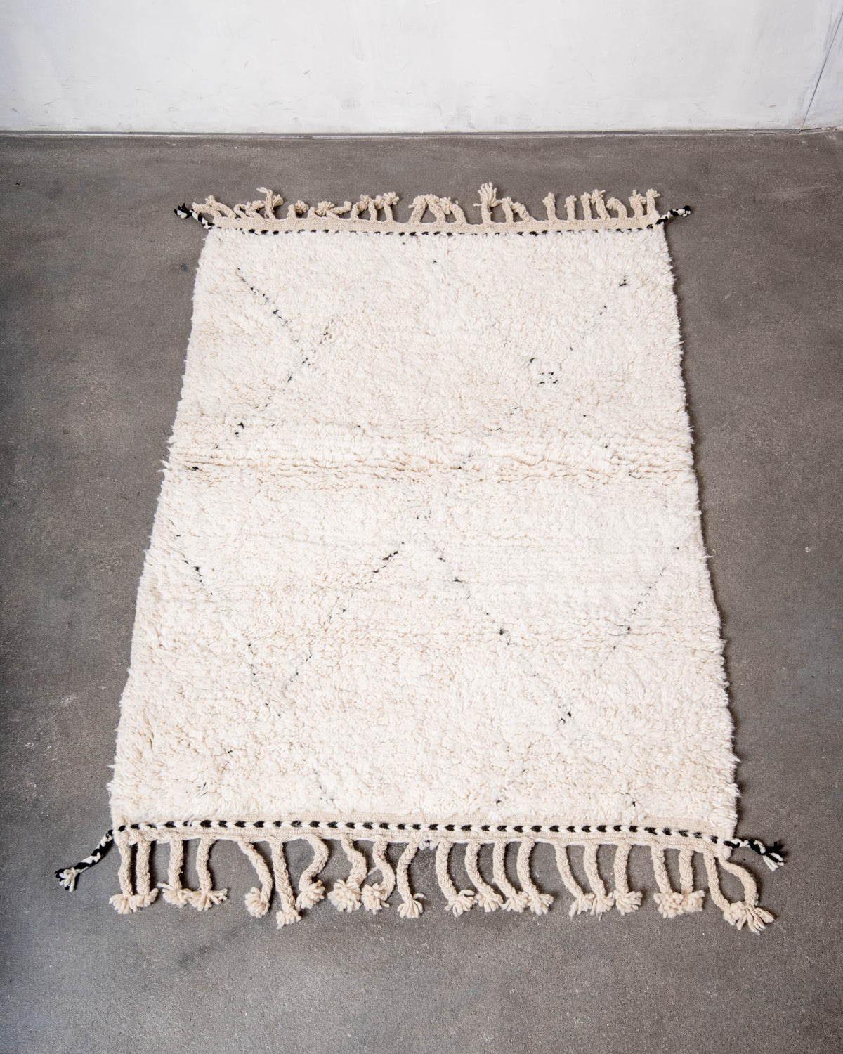 Modern, designer, handcrafted Berber rug from Morocco. Beniourain carpet with minimalist design, natural wool pile and a fluffy texture.